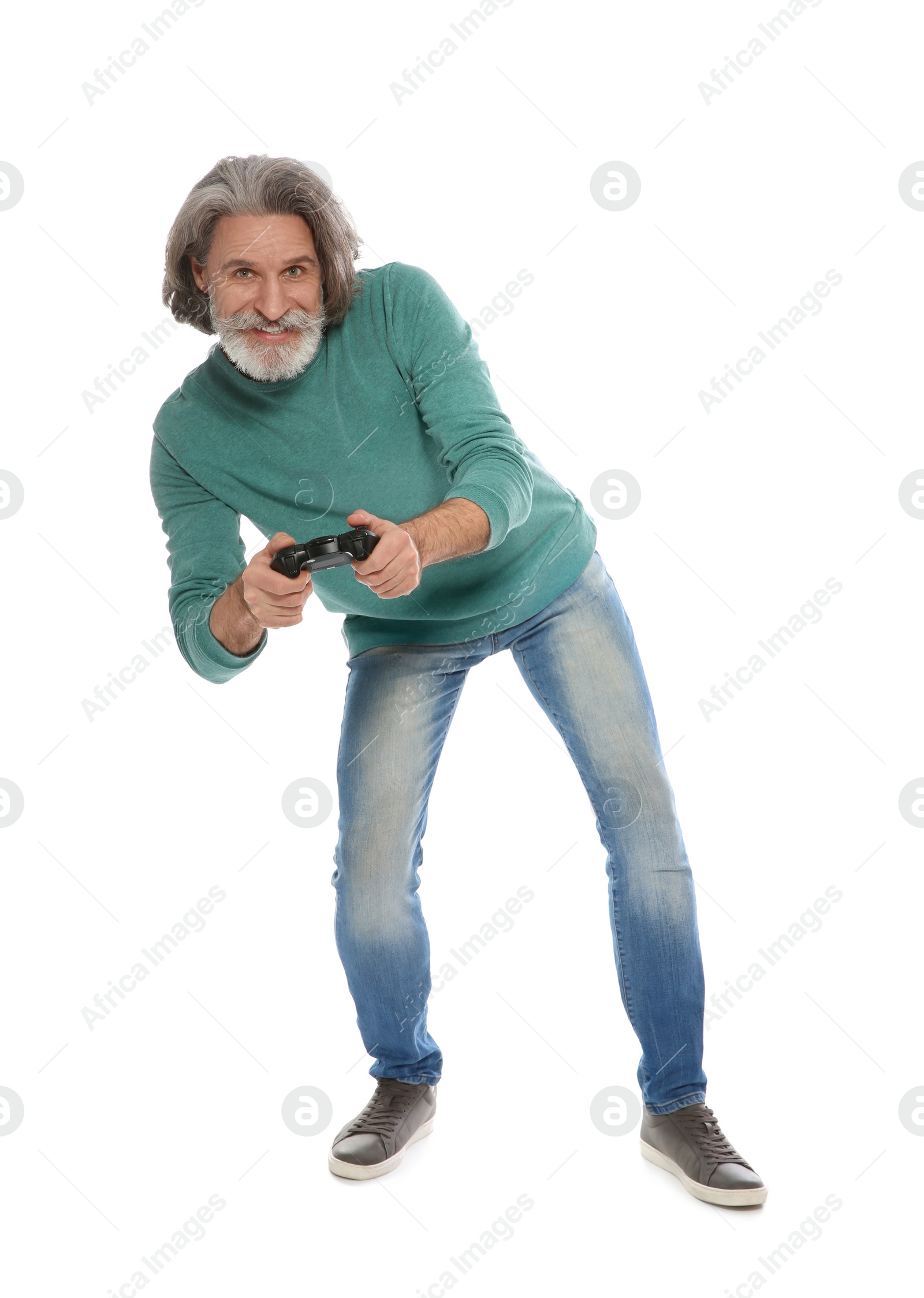 Photo of Emotional mature man playing video games with controller isolated on white