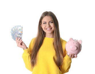 Portrait of happy young woman with money and piggy bank on white background