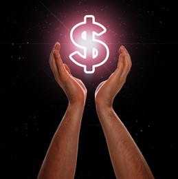 Image of Man demonstrating virtual dollar sign on dark background, closeup