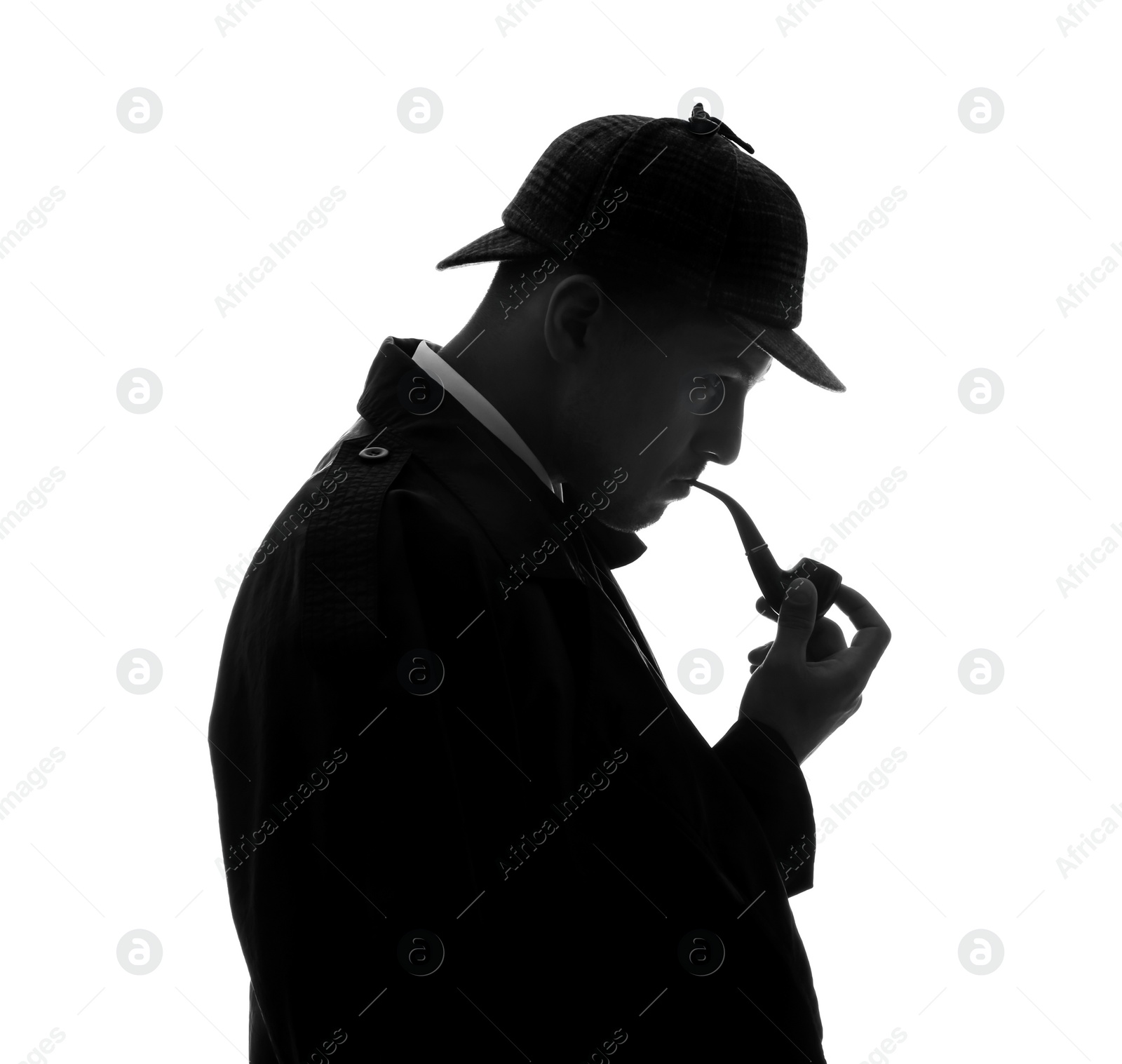 Photo of Old fashioned detective with smoking pipe on white background