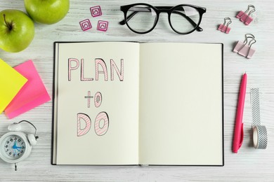 Flat lay composition of notebook with Plan To Do on white wooden table