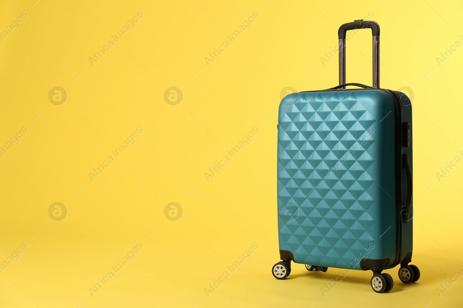 Photo of Stylish suitcase on color background. Space for text