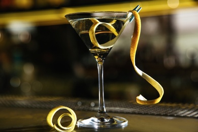 Photo of Glass of lemon drop martini cocktail on bar counter