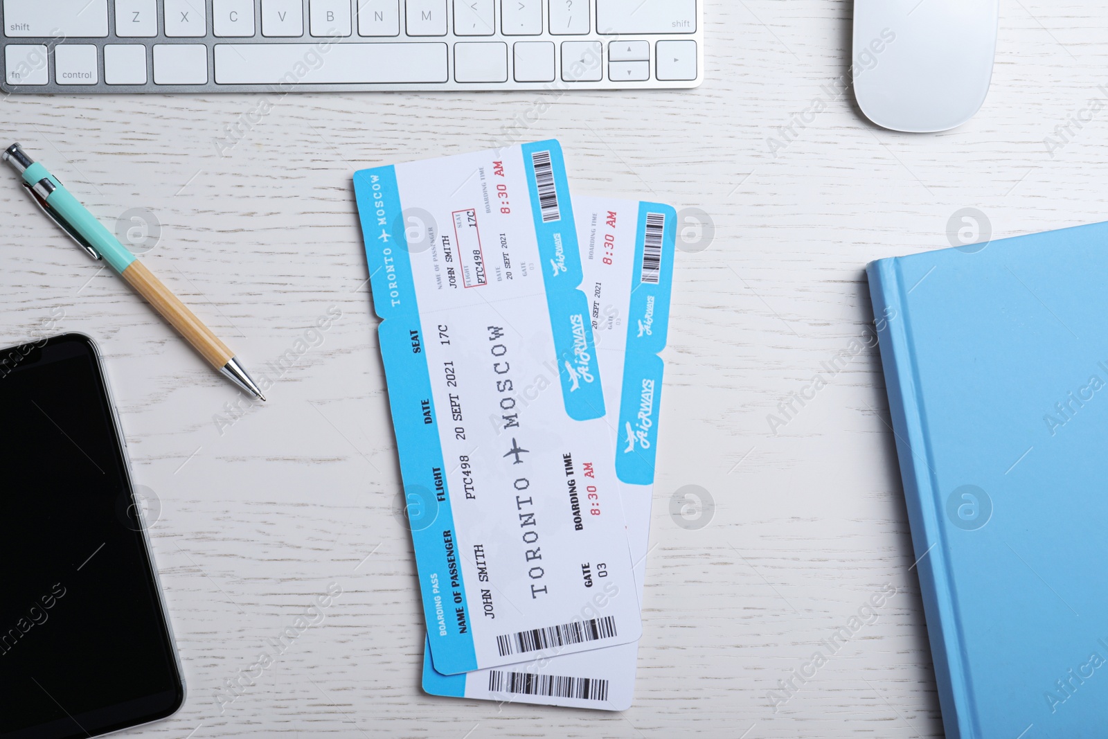 Photo of Flat lay composition with avia tickets on white table. Travel agency concept