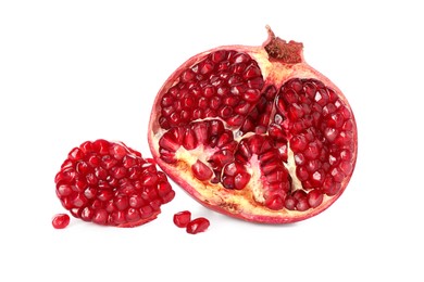 Half of pomegranate and juicy seeds isolated on white