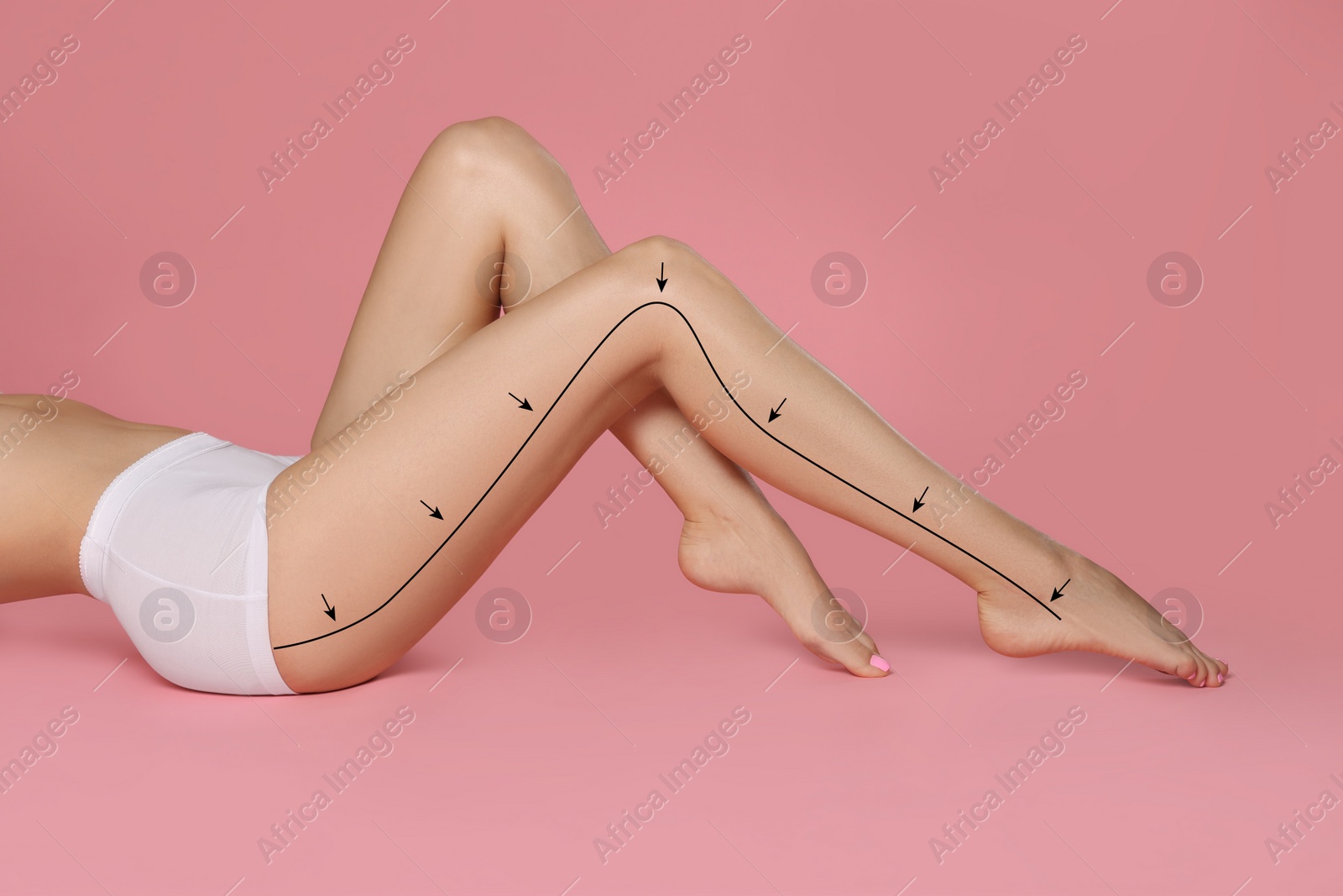 Image of Epilation guide - how to remove hair in proper direction. Woman with drawn lines and arrows on her beautiful smooth legs against pink background