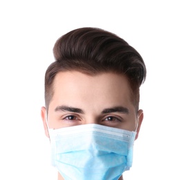 Young medical student with face mask on white background, closeup