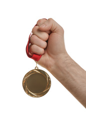 Photo of Man holding golden medal on white background, closeup. Space for design