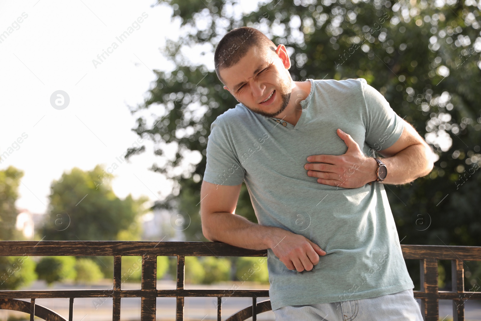 Photo of Man having heart attack on city street