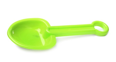 Photo of Green plastic toy shovel isolated on white