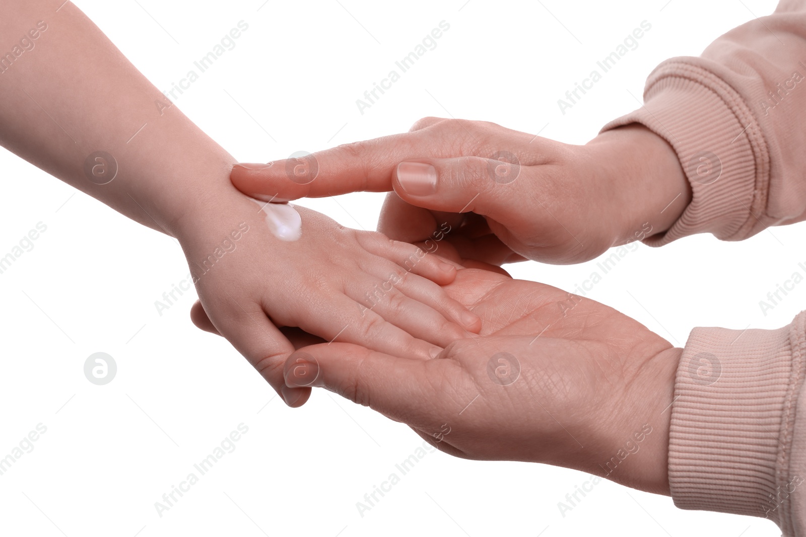 Photo of Mother applying ointment onto her son`s hand on white background, closeup