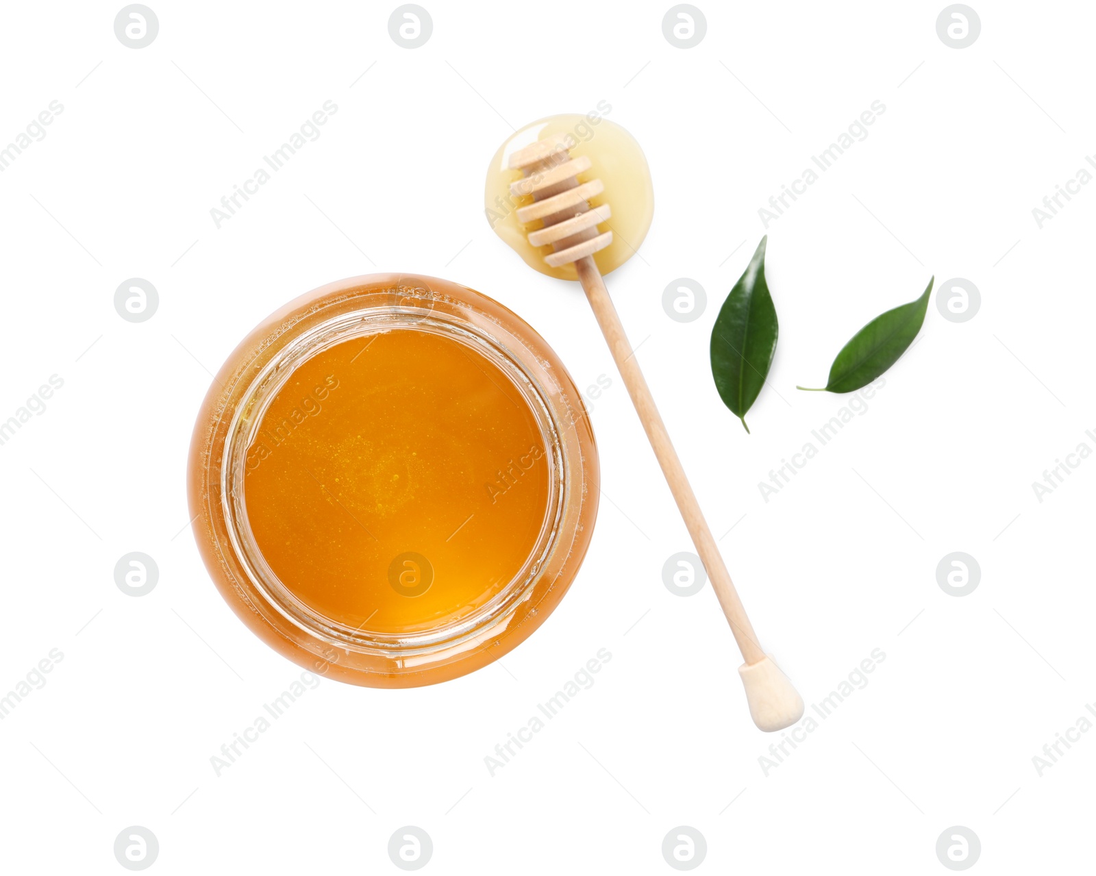 Photo of Tasty honey in glass jar, dipper and leaves isolated on white, top view