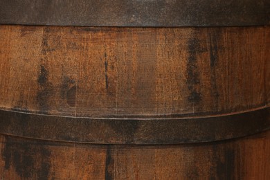 Traditional wooden barrel as background, closeup. Wine making