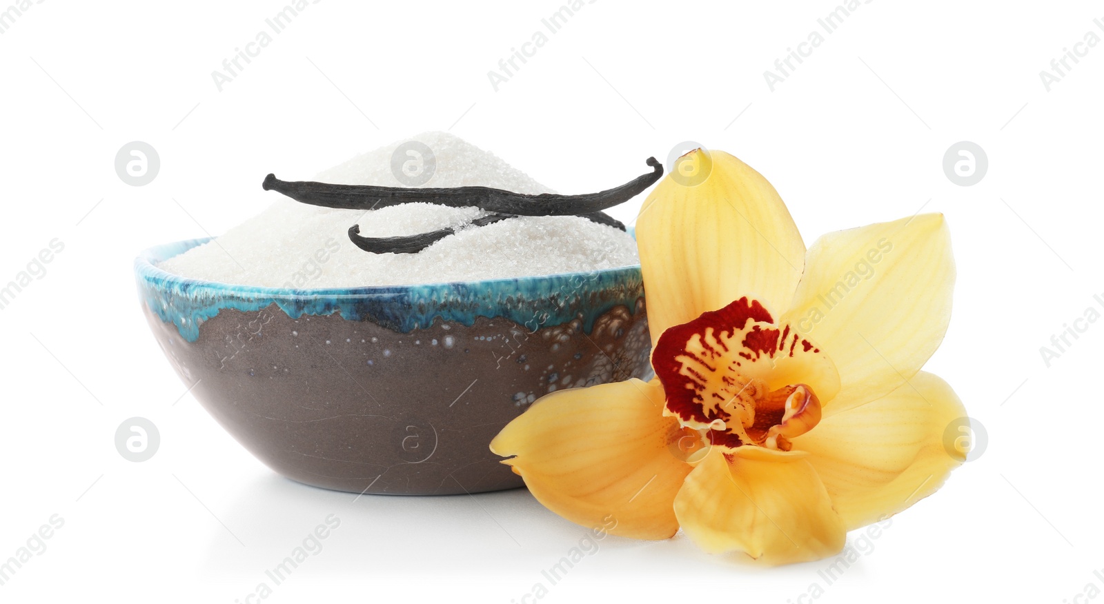 Photo of Vanilla sugar in bowl with flower and sticks on white background