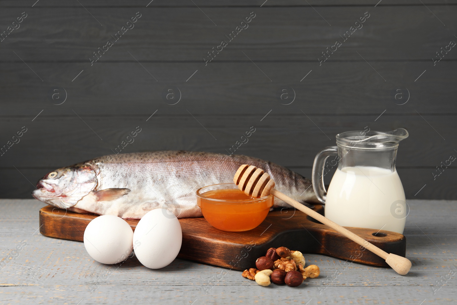 Photo of Allergenic food. Different fresh products on light gray wooden table, space for text
