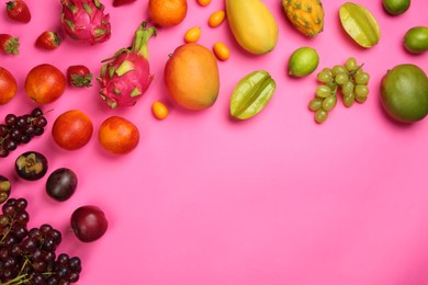 Photo of Many different delicious exotic fruits on pink background, flat lay. Space for text