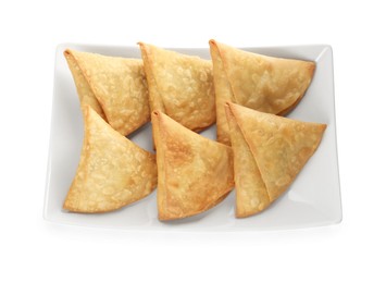 Photo of Fresh delicious crispy samosas on white background, top view