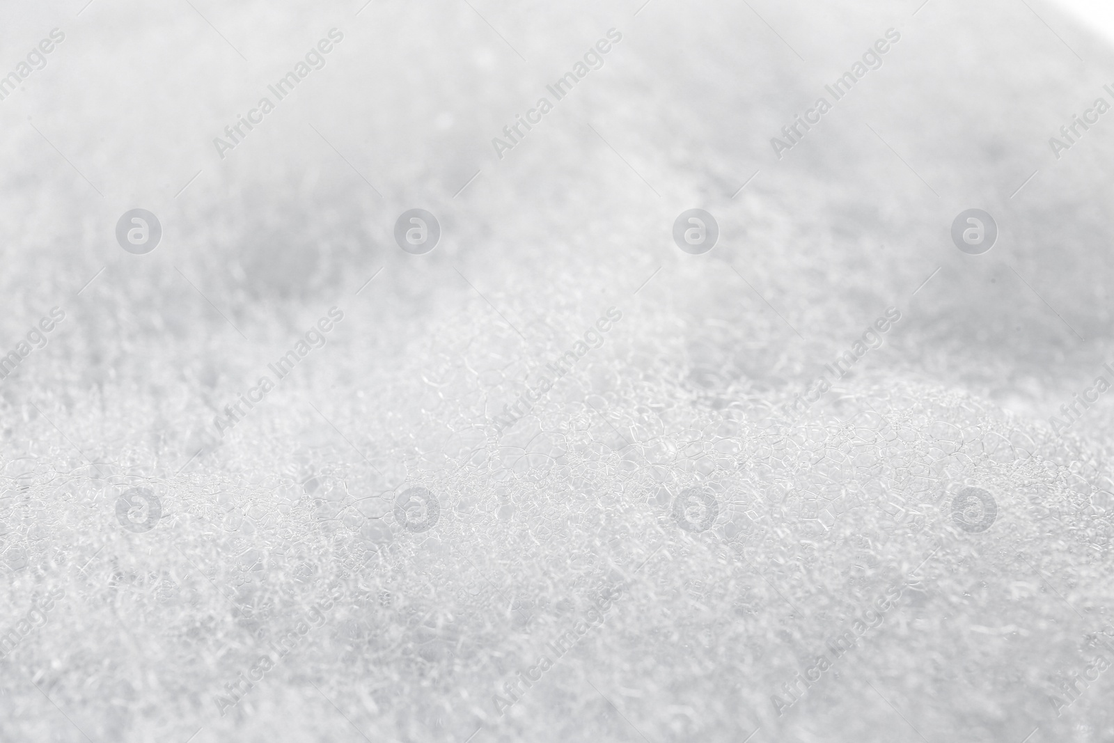 Photo of Texture of cleansing foam, closeup. Skin care cosmetic
