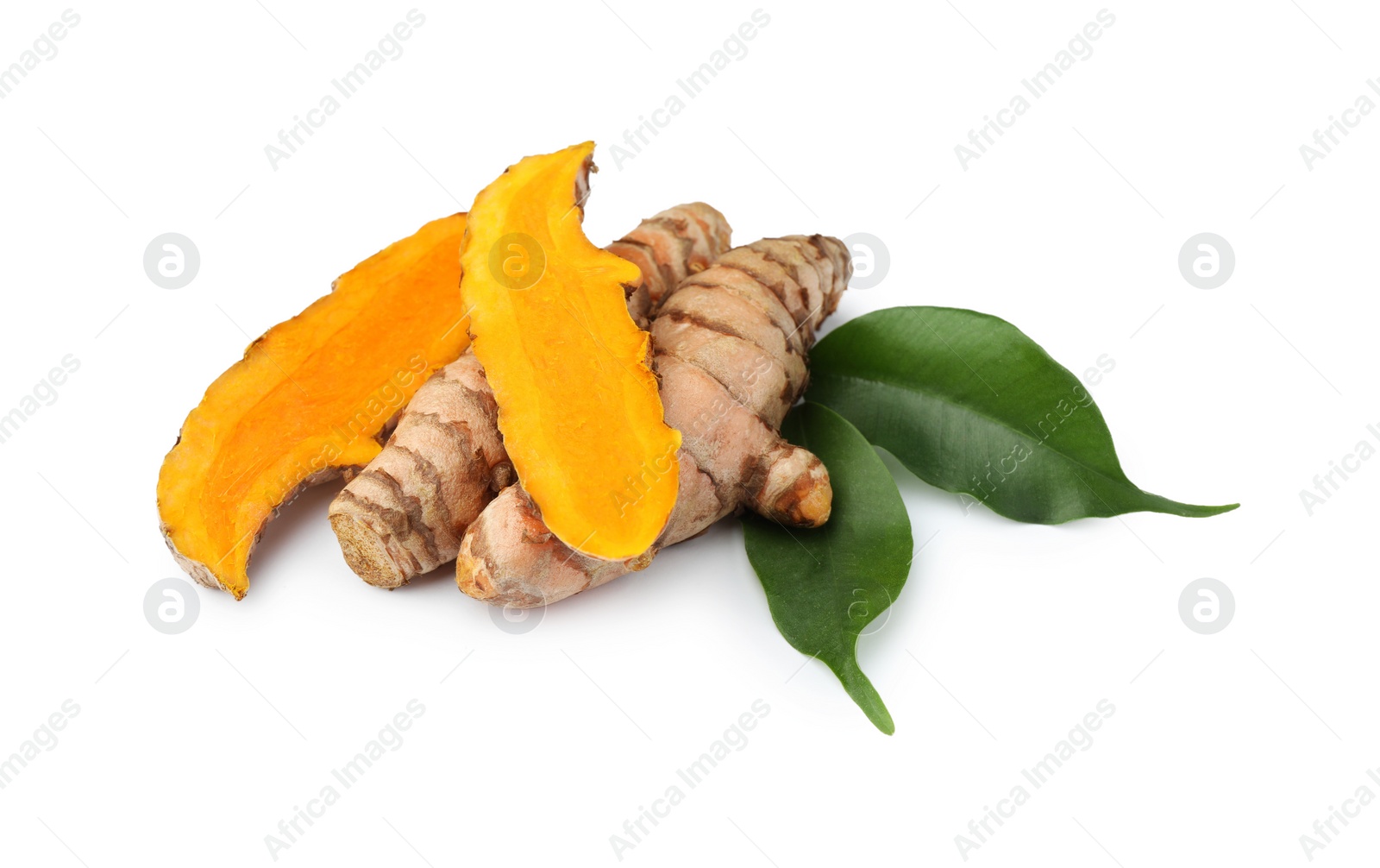 Photo of Fresh turmeric roots and green leaves isolated on white