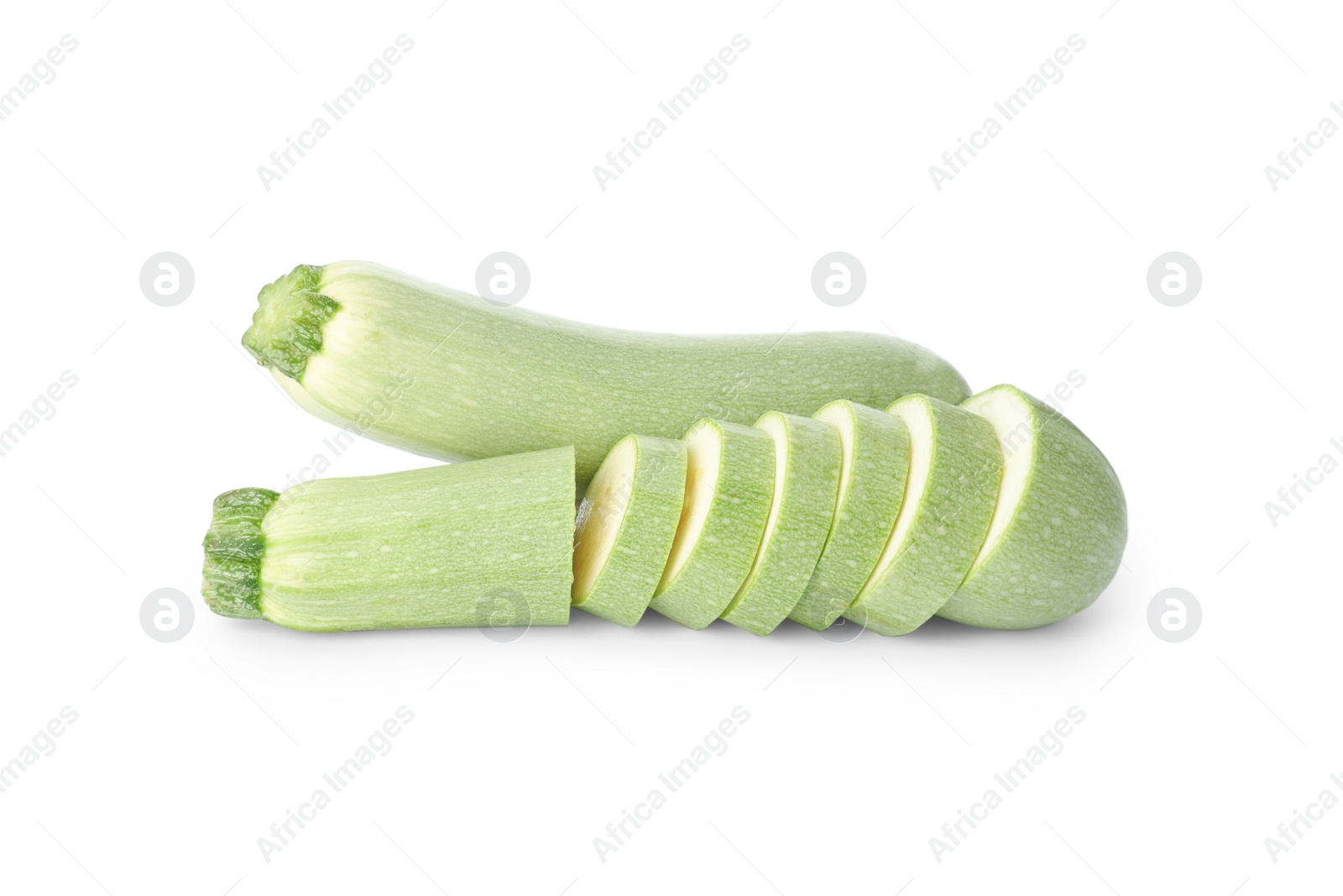 Photo of Cut and whole green ripe zucchinis on white background