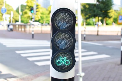 Photo of Modern bicycle traffic light on city street