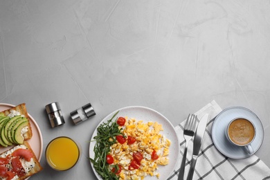 Photo of Delicious breakfast served on light grey table, flat lay. Space for text