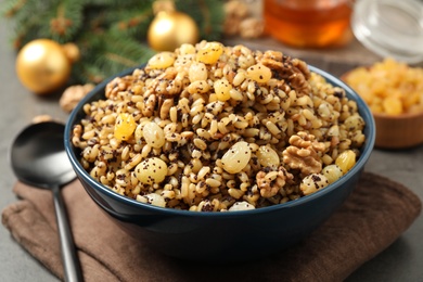 Photo of Traditional Christmas slavic dish kutia served on table, closeup