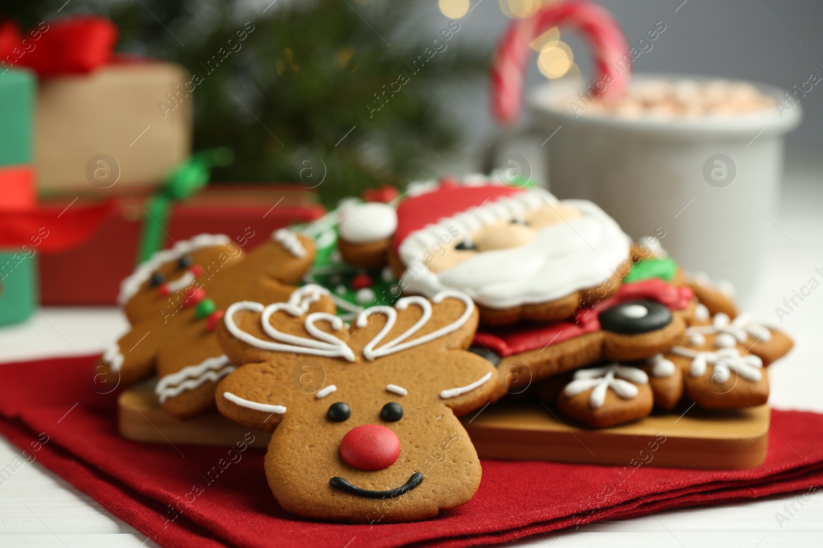 Photo of Tasty homemade Christmas cookies on white wooden table, closeup