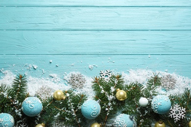 Photo of Flat lay composition with Christmas decorations on blue wooden background, space for text. Winter season