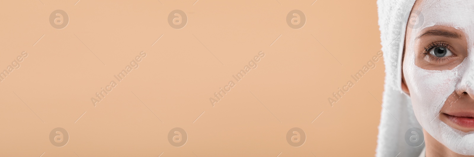 Image of Spa treatment. Woman with face mask on pale orange background. Banner design with space for text