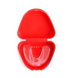 Transparent dental mouth guard in container isolated on white, top view. Bite correction