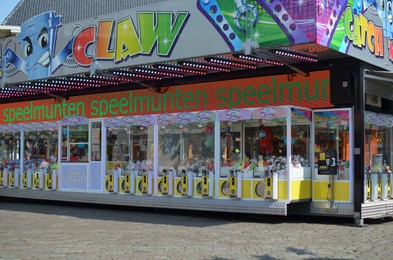 Netherlands, Groningen - May 18, 2022: Crane machines with many different toys in amusement park