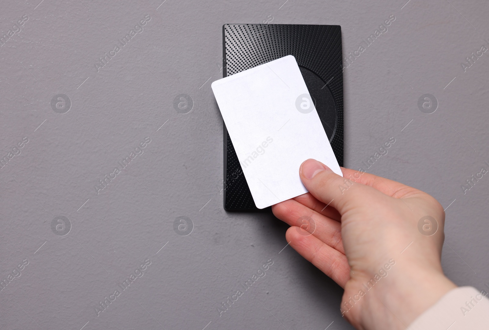 Photo of Woman opening magnetic door lock with key card, closeup and space for text. Home security