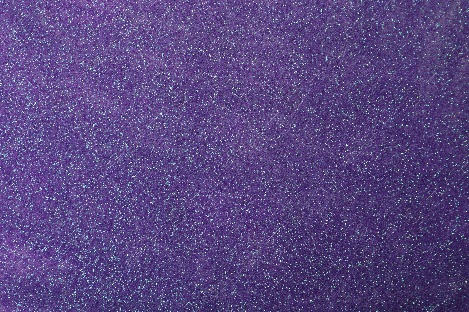 Photo of Beautiful shiny violet glitter as background, closeup