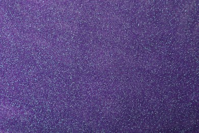 Beautiful shiny violet glitter as background, closeup