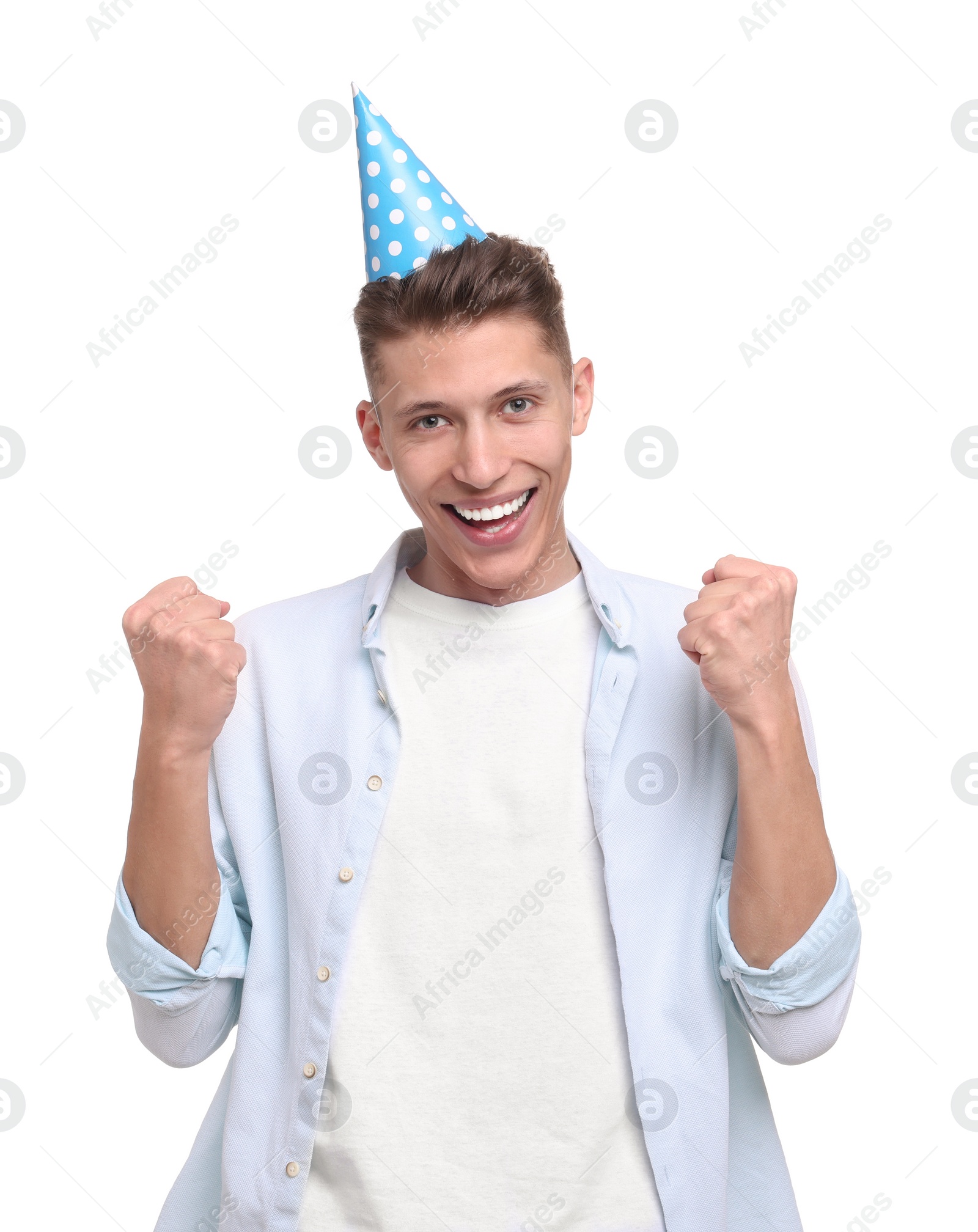 Photo of Happy young man in party hat on white background