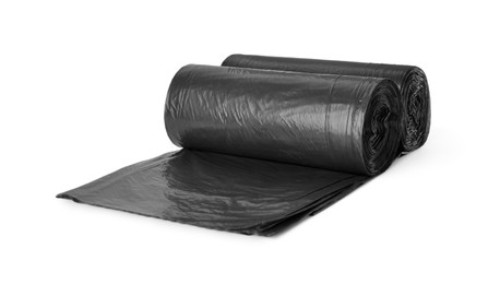 Rolls of black garbage bags isolated on white