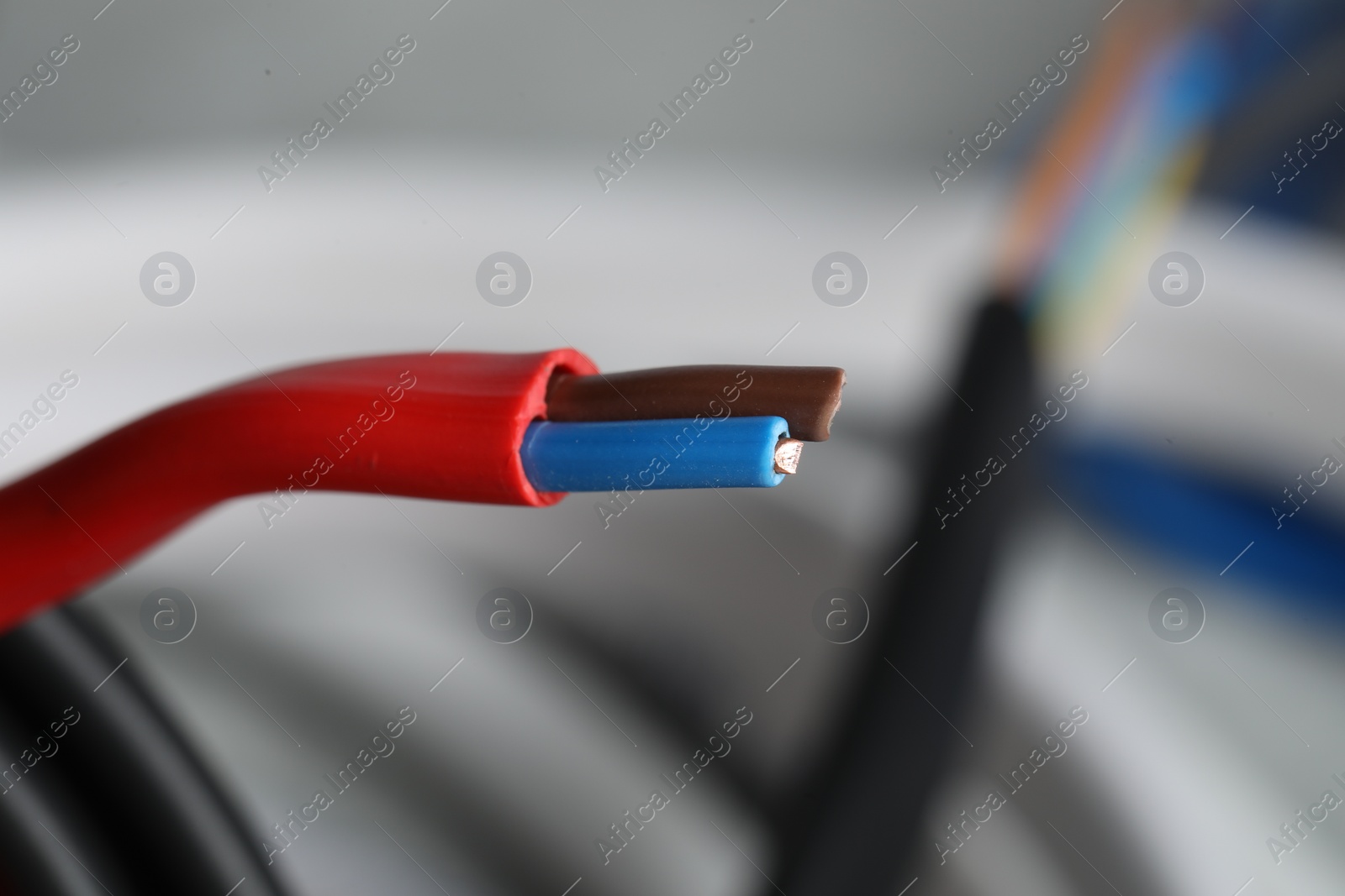 Photo of Colorful electrical wire on blurred background, closeup