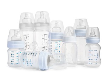 Photo of Many different empty feeding bottles for infant formula on white background