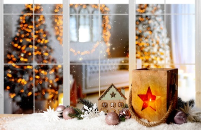 Image of Beautiful composition with wooden Christmas lantern near window