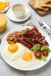 Photo of Delicious breakfast with sunny side up eggs on light table