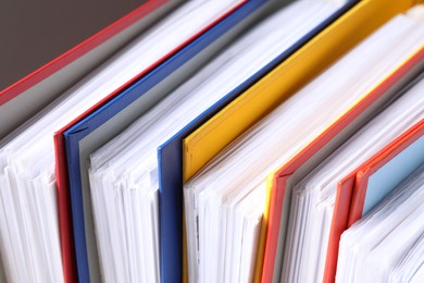 Photo of Colorful binder office folders as background, closeup