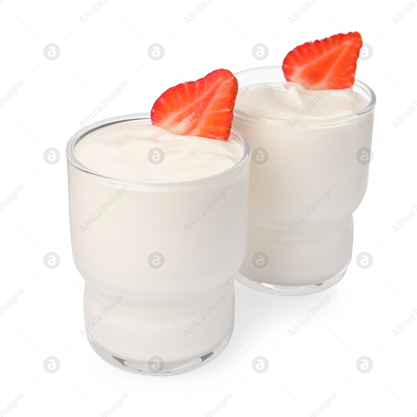 Photo of Glasses with delicious yogurt and strawberries on white background