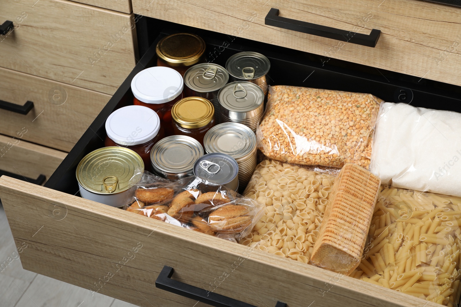 Photo of Open drawer with different products. Food donation