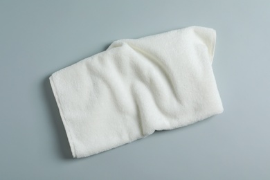 Photo of Soft towel on light background, top view
