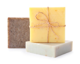 Photo of Different handmade soap bars on white background