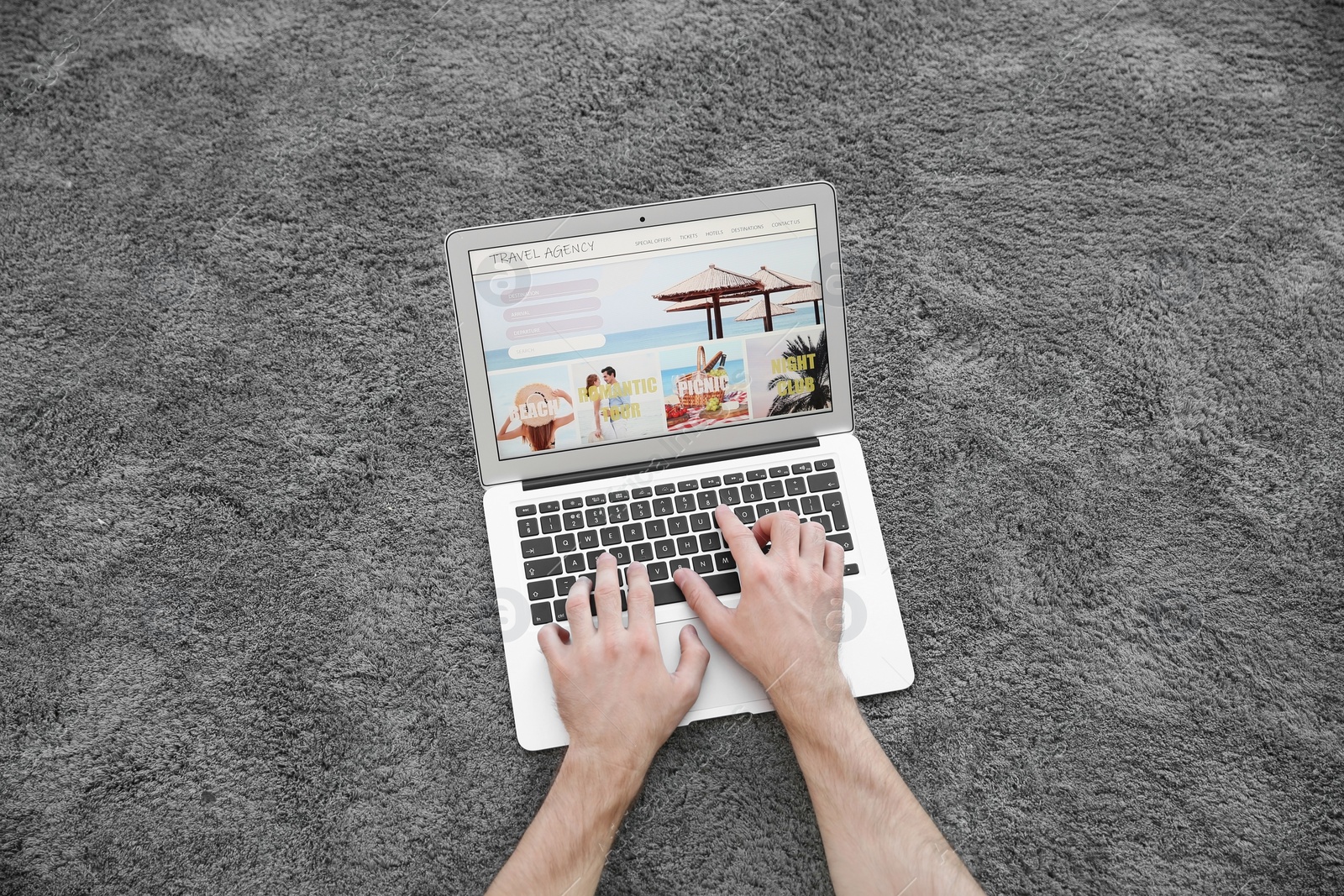 Photo of Man booking tickets online indoors, closeup. Travel agency concept