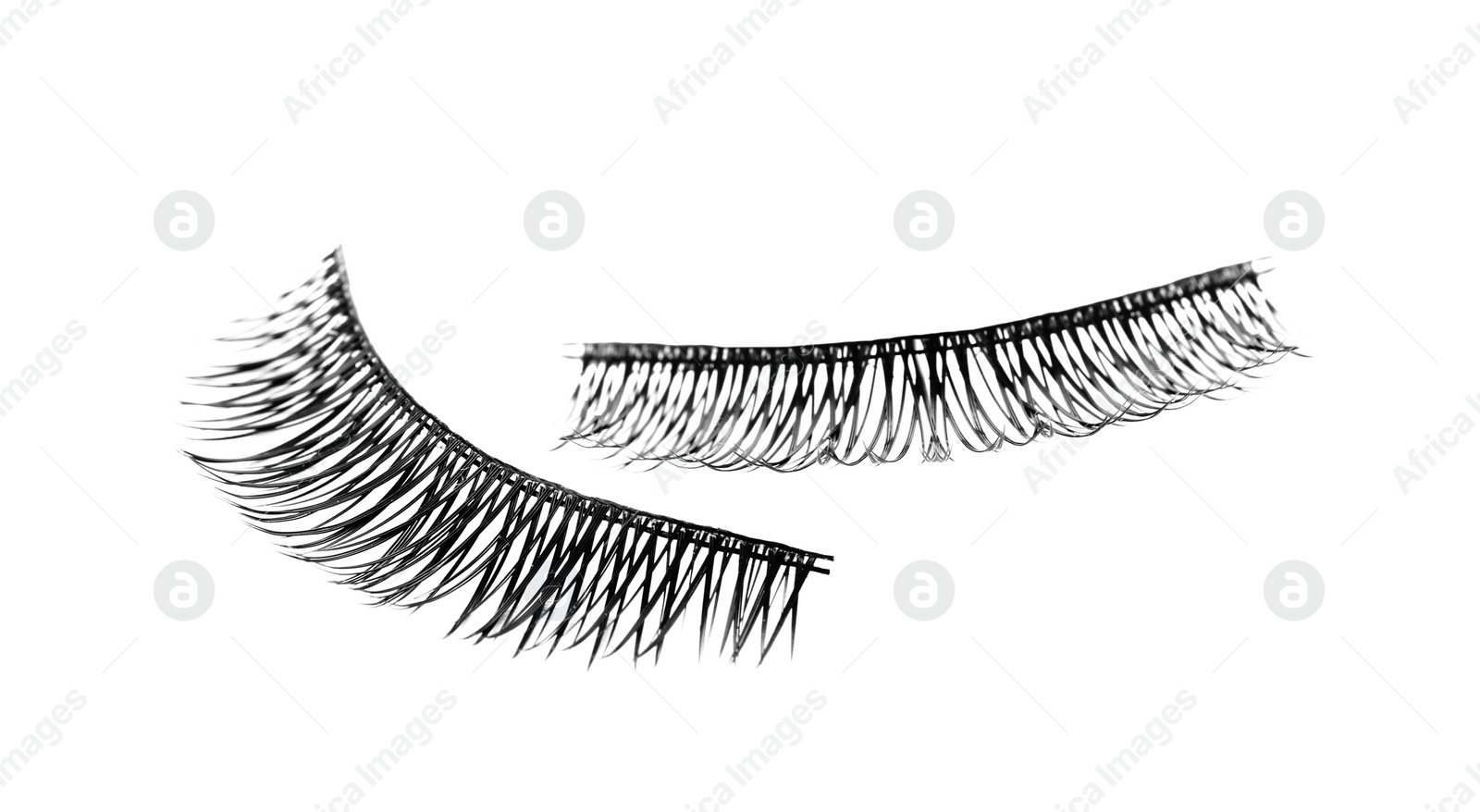 Photo of Fake eyelashes on white background. Makeup product