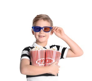 Photo of Cute boy in 3D glasses with popcorn buckets isolated on white