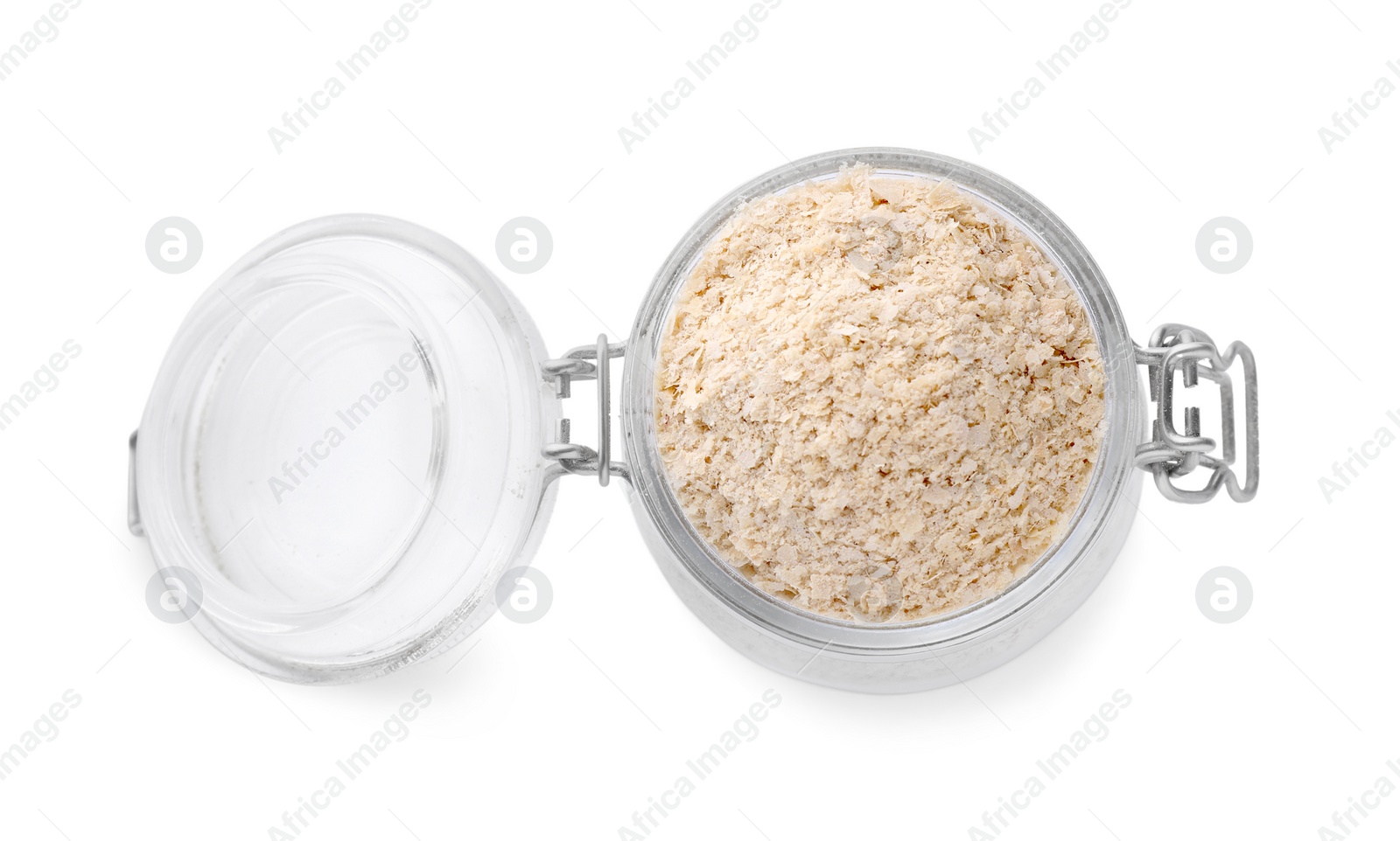 Photo of Brewer's yeast flakes in glass jar isolated on white, top view